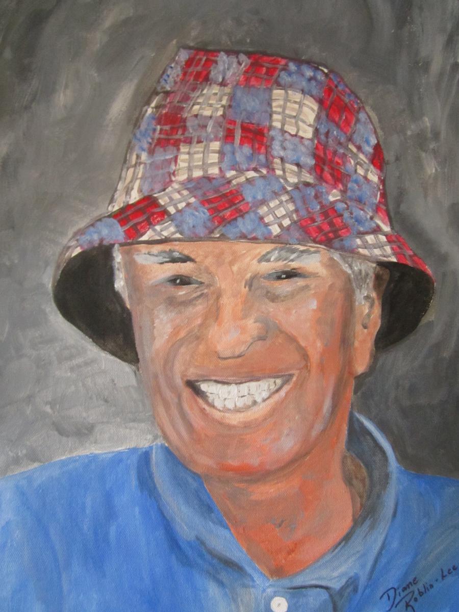 Old man with plaid bucket hat painting